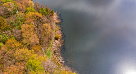 Aerial view on Navariya Lake (Shchyrka Reservoir), forest and field from drone