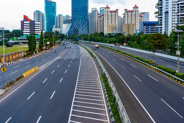 Jakarta, Indonesia - 3rd May 2020: Empty or deserted Jakarta street in times of covid 19 pandemic. People are working from home to reduce the spread of covid 19 epidemic.