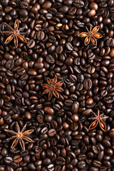 Coffee beans background with anise stars. Christmas concept. Selective focus. Monochrome image. Food background.