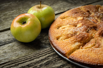 English Apple pie on a wooden background. fresh sweet pastries