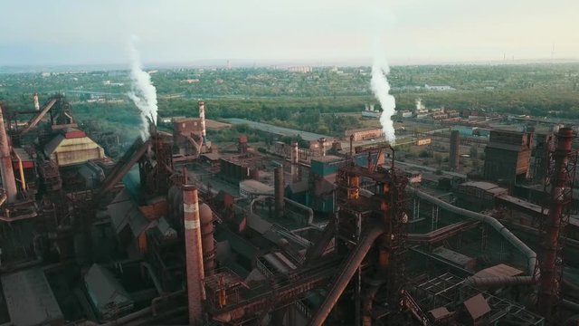 Industrial production plant metallurgical steel aerial video 4K smoke from chad pipes.