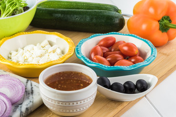 Spiral zucchini noodles salad with variety vegetables.
