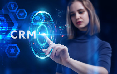 Business, Technology, Internet and network concept. Young businessman working on a virtual screen of the future and sees the inscription: CRM