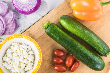 Spiral zucchini noodles salad with variety vegetables.
