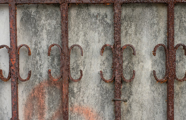 old cage with rusty  attached  to the wall use it for a background