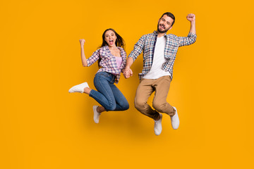 Full length photo ecstatic crazy woman man jump enjoy rejoice lucky covid-19 victory news raise...