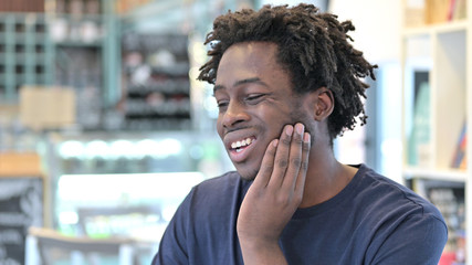 Portrait of Sick African Man with Toothache
