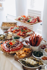 Buffet table at the wedding, sweet and meat