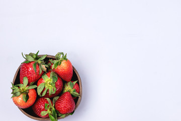 Coconut Bowl with Tasty Ripe Strawberry on Blue Background Healthy Vegan Food Top View Copy Space