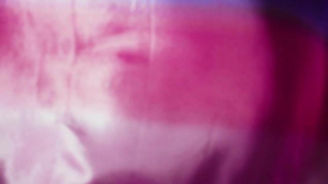 Pink and Purple silk satin sheet flag flowing in wind / slow motion / 180fps