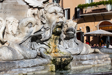Fototapeta na wymiar Rome, sculptures of the fountain in the square near the temple of all the Gods - the Pantheon