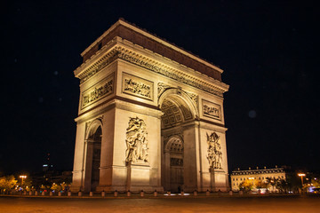 Fototapeta na wymiar Arc de Triomphe of Paris on Charles de Gaulle Square at night