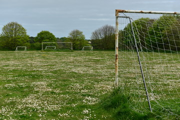 Fototapeta na wymiar Abandoned sports field, Jersey, U.K. Empty Spring landscape