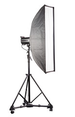 Photo studio lighting stands with flash and softbox isolated on the white.