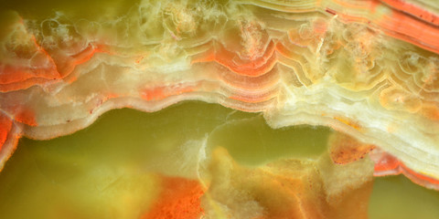 The surface of the onyx stone. Polnoratsionny stone, a variety of agate in green, yellow tones