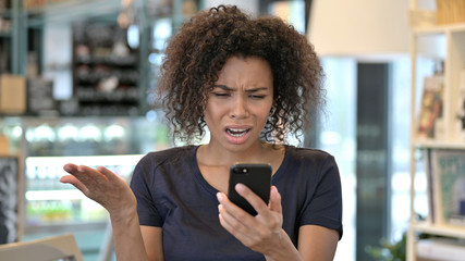 Young African Woman Reacting to Online Loss