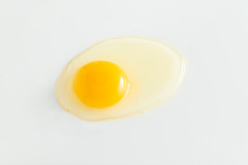 Broken chicken egg on a white background.