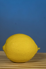 Citrus fruits- lemon, on the wooden , On a blue background