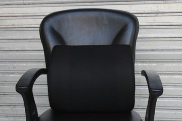 Black Memory foam pillow in a black office seat 