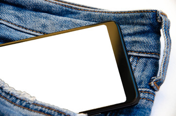 White screen smartphone in jeans pocket. Smartphone place for text. Smartphone in a pocket on a white background.  Copy Space