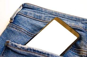 White screen smartphone in jeans pocket. Smartphone place for text. Smartphone in a pocket on a white background.  Copy Space