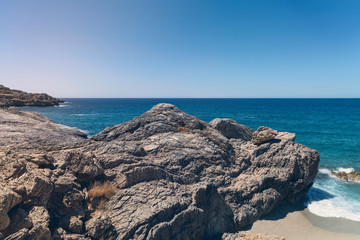 rocky bays on crete with blue sea and sky