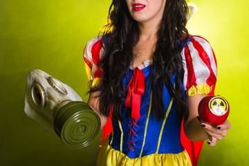Woman dressed as fairytale character holds Radioactive atomic nuclear ionizing radiation danger...