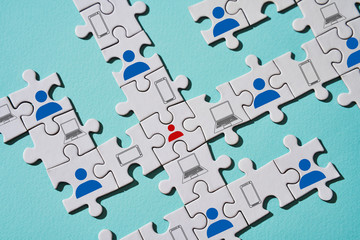 Puzzle pieces as example of stopping the spread of virus with help online communication.
