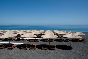 Beach umbrellas and chairs in Greece. Closed season 2020. 