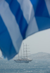 Ship in the sea and Greek flag. Closed season 2020. 