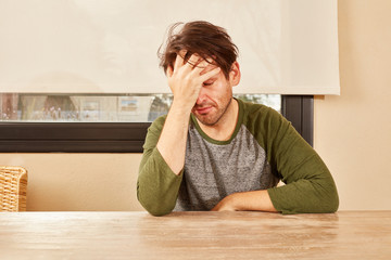 Desperate or exhausted young man