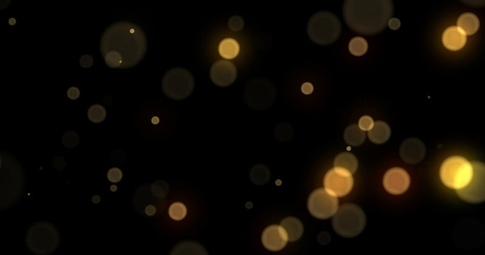 Light bokeh gold background, abstract golden shine with blur. Yellow light bokeh glitter flares effect, glittery particles and bright, glowing shiny sparkles on black background, Christmas design