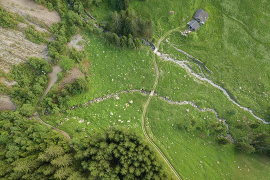 Aerial view of hiking trail over mountain creek