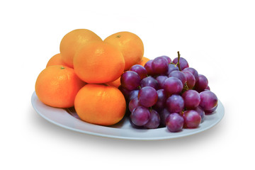 Fruits, grapes and oranges placed on a white container, on white isolated background.