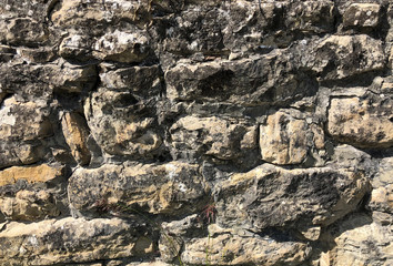 old stone wall background. copy space. Textured stone close-up
