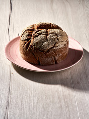 Traditional bread on wooden table