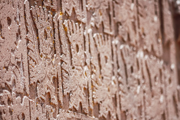 detail of the decorative reliefs of the Puerta del Sol in Tiwanaku, Bolivia