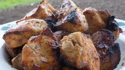 cooking pork skewers on the grill. meat with spices.