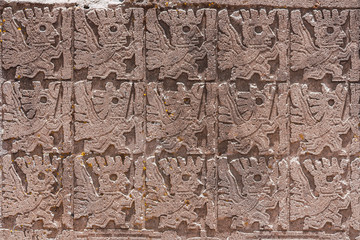 detail of the decorative reliefs of the Puerta del Sol in Tiwanaku, Bolivia