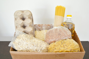 Food delivery, donation box, food box. Long-term storage products. Food supplies for the period of quarantine isolation.
