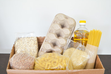 Food delivery, donation box, food box. Long-term storage products. Food supplies for the period of quarantine isolation.