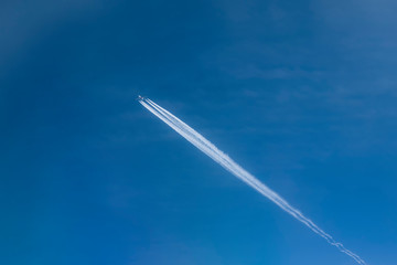 Two planes in the sky flying at close range from each other. One aircraft is fully visible, the other aircraft can see the wing. Concept: dangerous rapprochement of planes. Copy space.