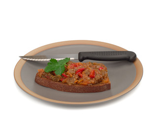 eggplant caviar on the piece of bread in the plate