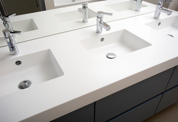 Three sink bathroom with three washbasin and three faucet white modern design with mirror