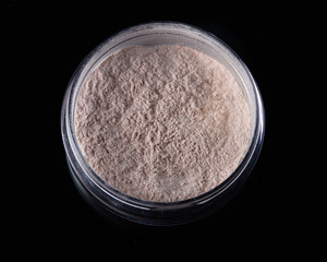 Top View of Cosmetic Powder in Plastic Circular Container.