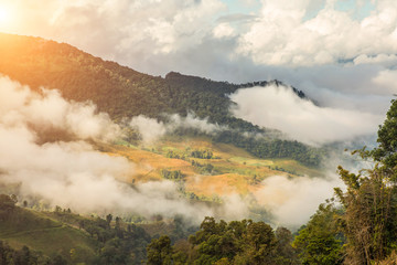 Beautiful of multiple mountains valley at sunrise in the morning at Phu chi Duen, Chiang Rai Province, Thailand