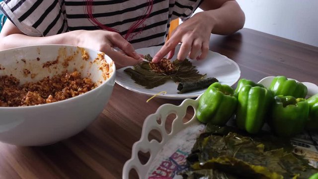 stuffing peppers with home mortar from mother's hands at home