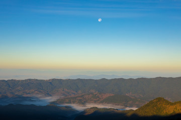 Beautiful of multiple mountains valley at sunrise in the morning at Phu chi Duen, Chiang Rai Province, Thailand