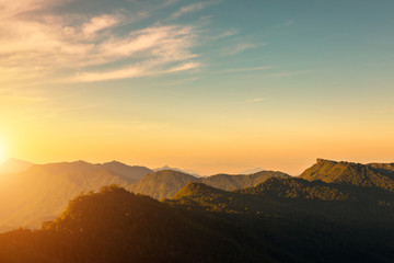 Beautiful of multiple mountains valley at sunrise in the morning at Phu chi Duen, Chiang Rai Province, Thailand