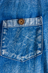 clothing items blue stonewashed faded jeans cotton fabric texture with seams, clasps, buttons and...